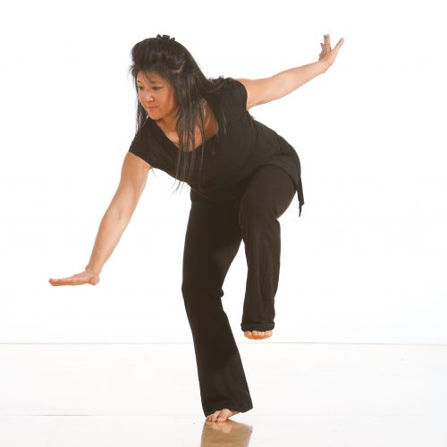 Claudine poses wearing all black