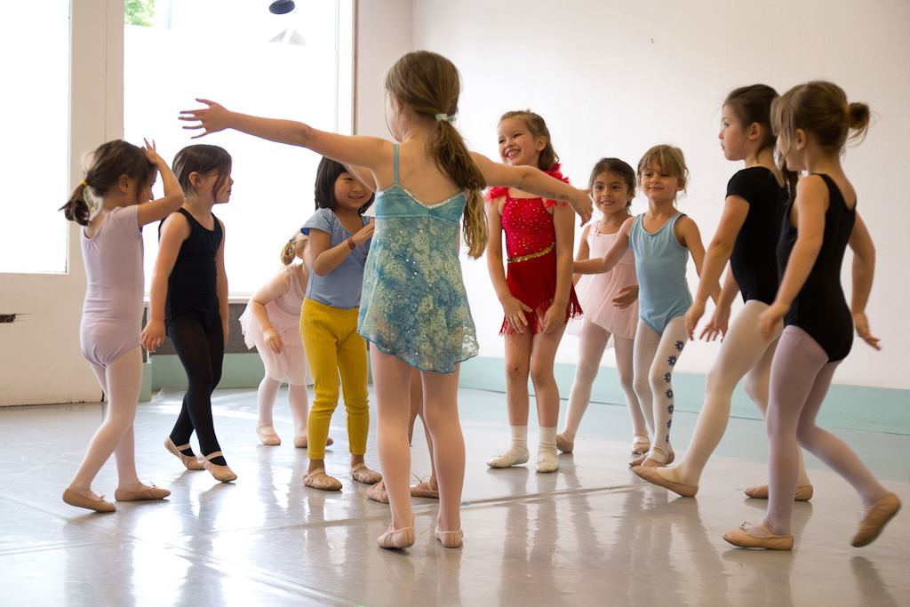 A group of young dancers in colorful leotards in Serendipity class