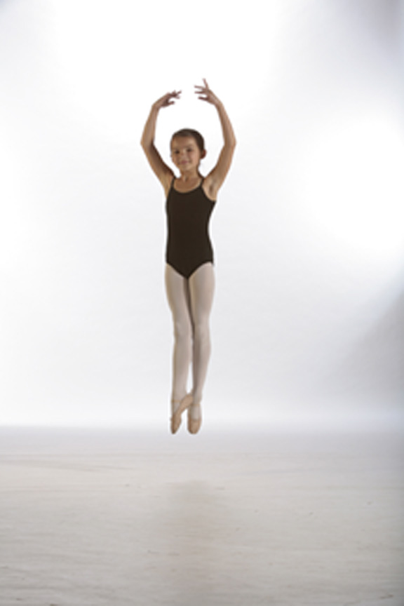 A young dancer mid jump