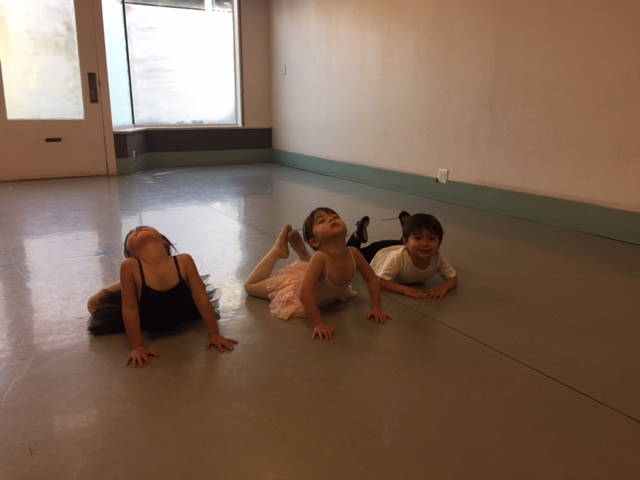 Three young dancers stretch in Serendipity