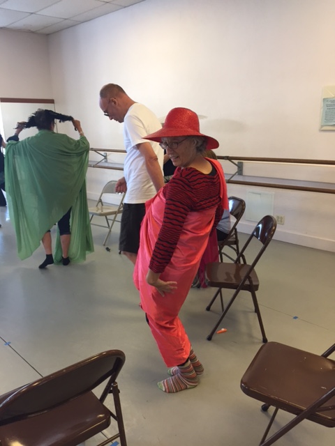 Many dancers in a Dance for PD class using props and moving around the space
