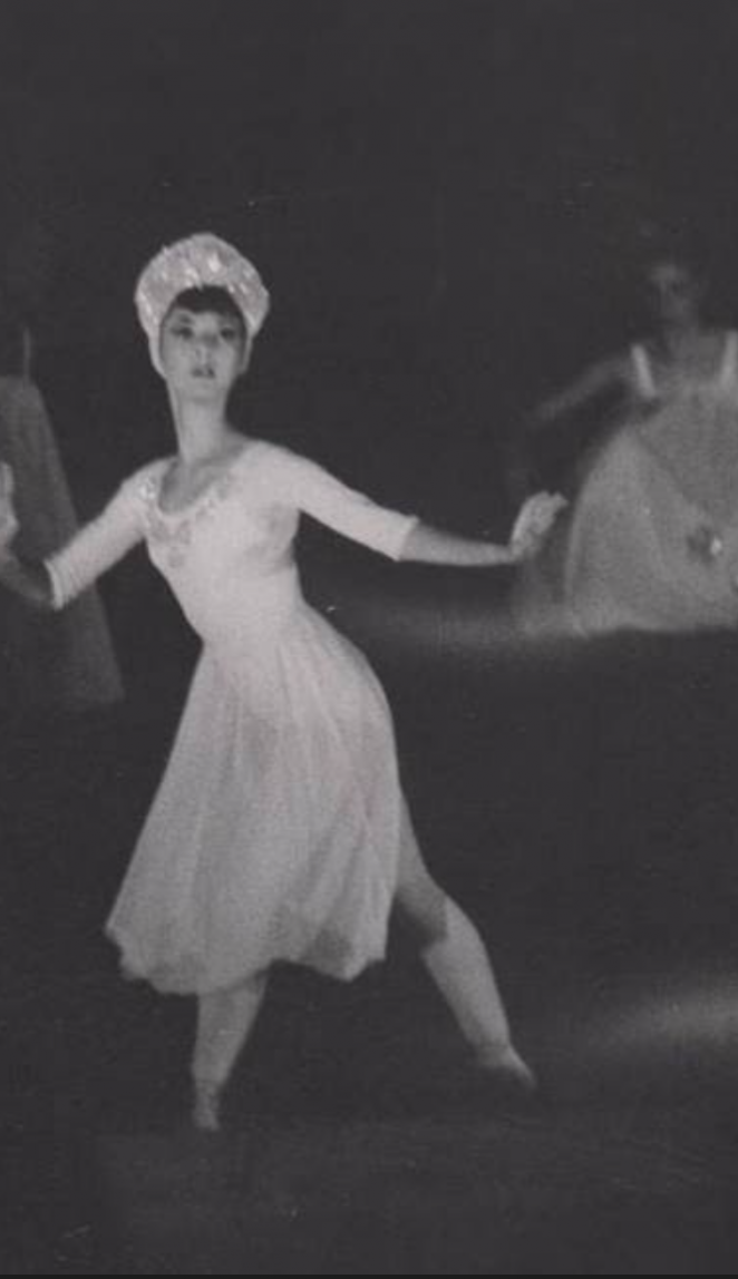 Scan of a photograph of Andra Corvino performing in the Waltz of the Snowflakes variation of the Nutcracker.
