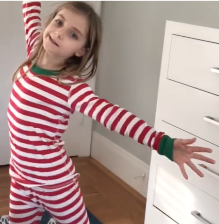 Screenshot of a dancer in red and white stripes dancing on zoom during the COVID-19 pandemic.