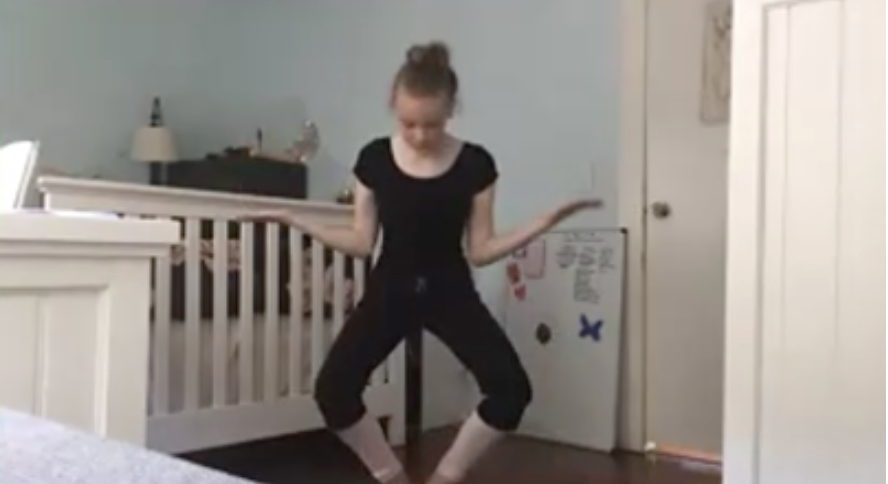 Screenshot of a dancer on zoom. She dancers in a room with a crib. During the COVID-19 pandemic.
