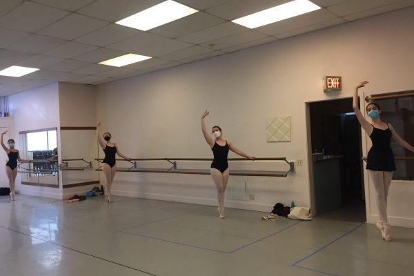 4 teen dancers in class in masks pose in sous-sous.