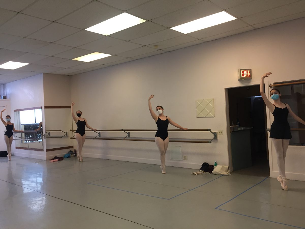 4 teen dancers in class in masks pose in sous-sous.
