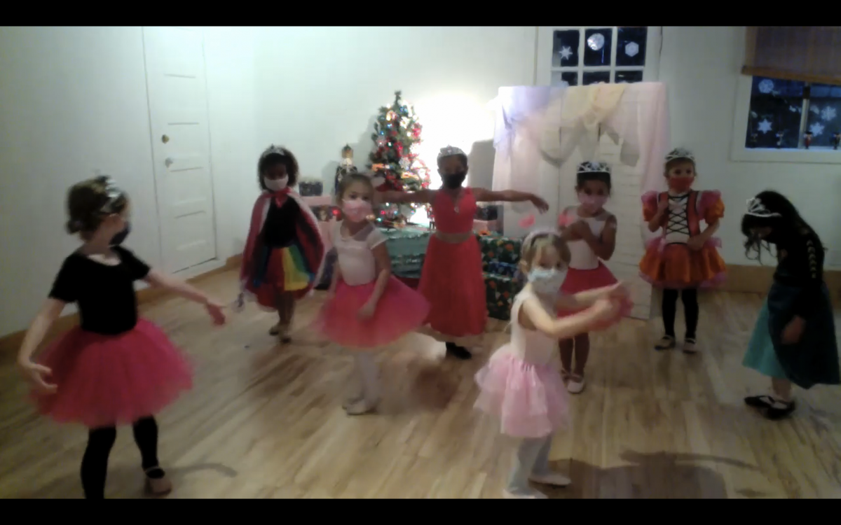 A screenshot of 8 young dancers during a sugar plum fairy performance in the studio.
