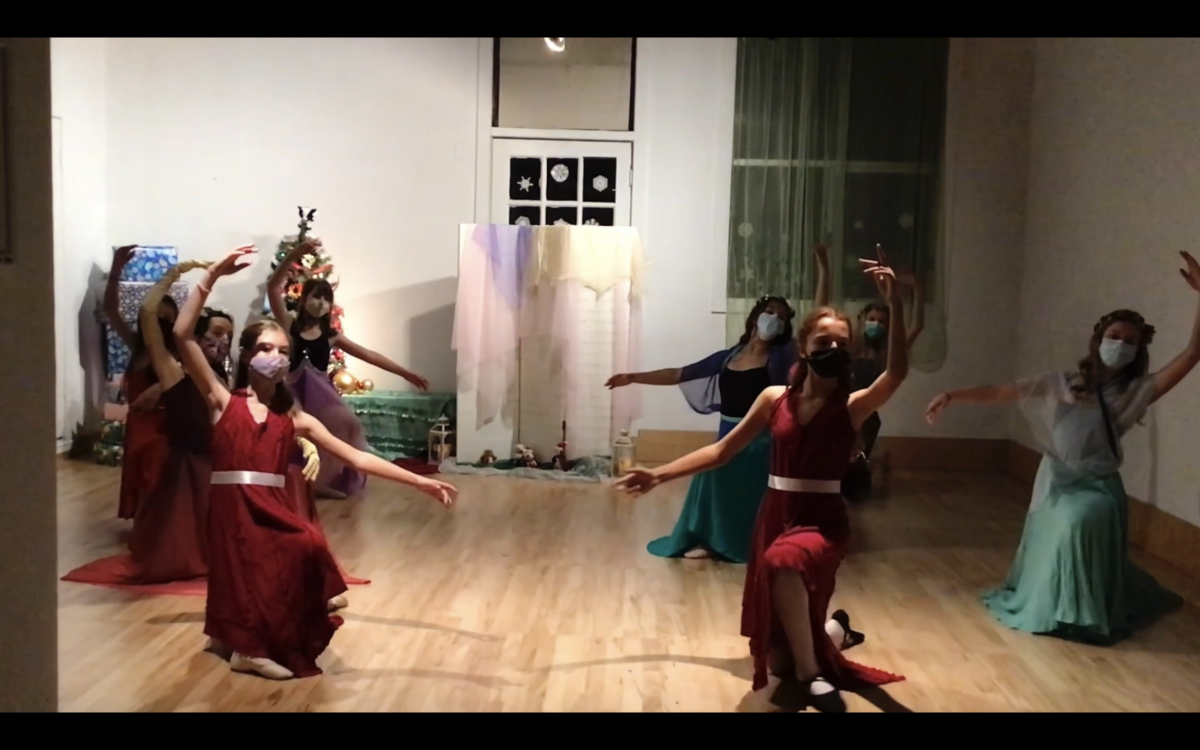 Screenshot of 8 dancers in a pose on one knee performing a Nutcracker variation in the studio.