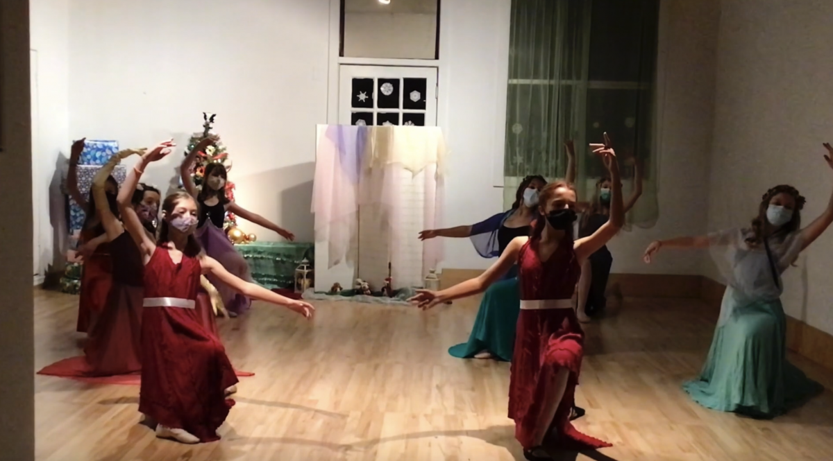 Screenshot of 8 dancers in a pose on one knee performing a Nutcracker variation in the studio.